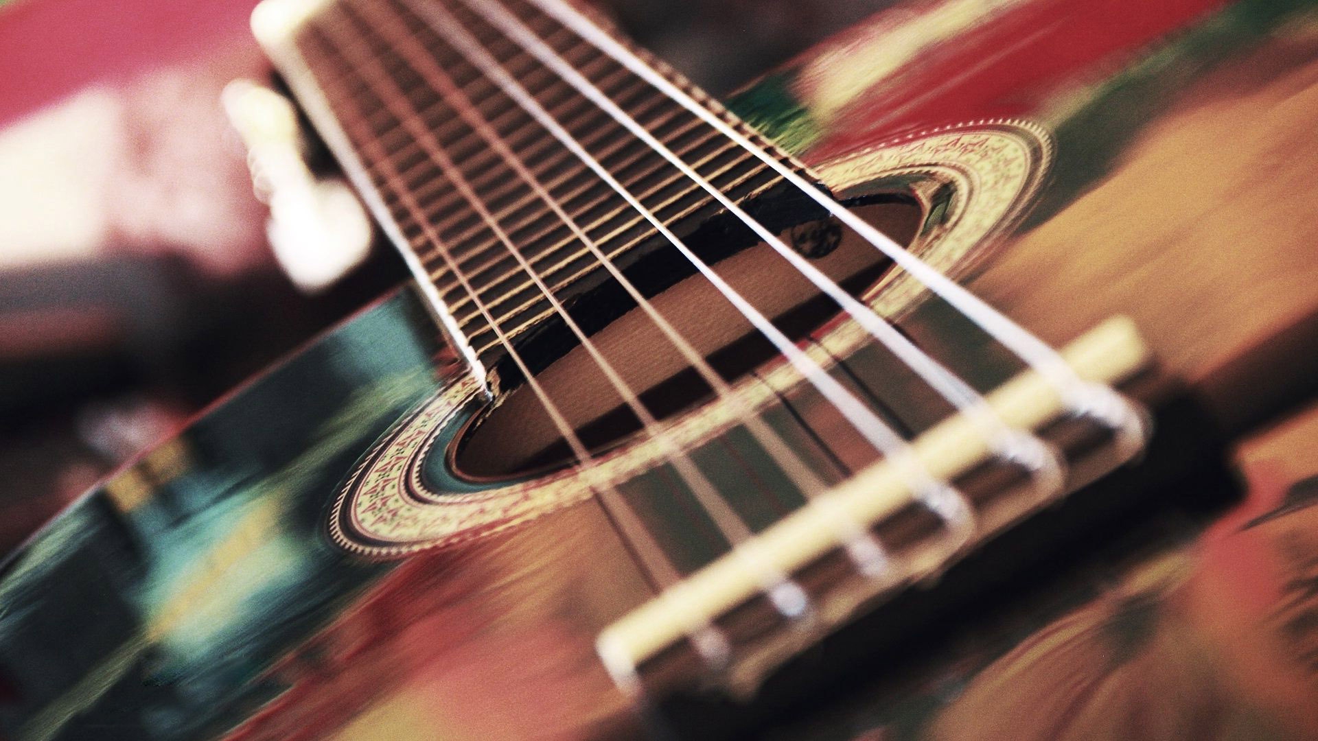 A close up picture of a acoustic guitar